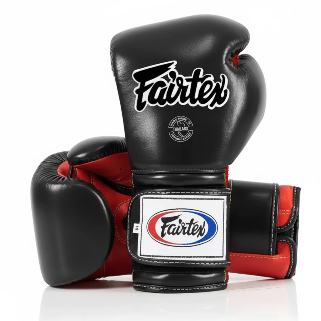 Black and red boxing gloves with Fairtex logo on a white background