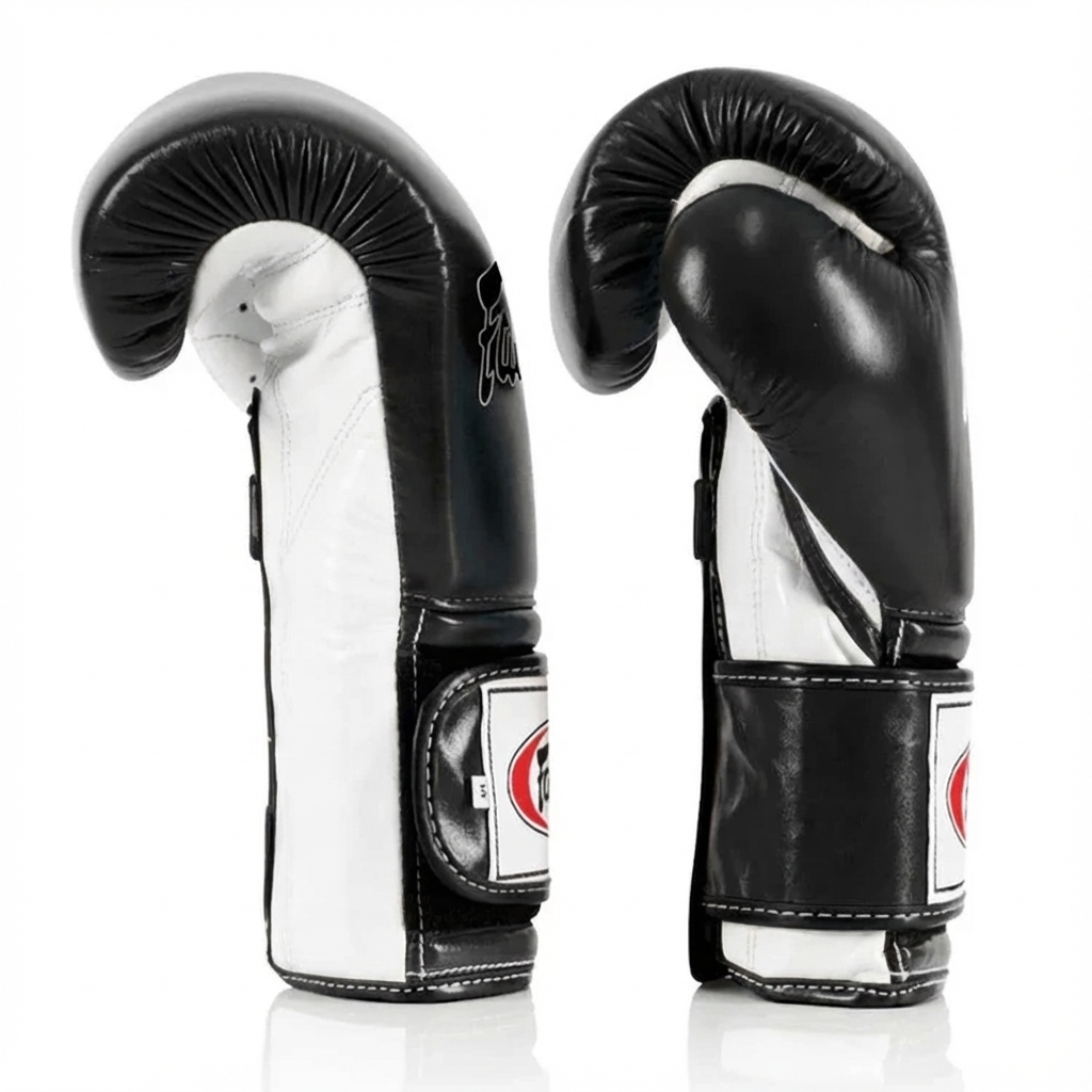 Pair of black and white boxing gloves on a white background