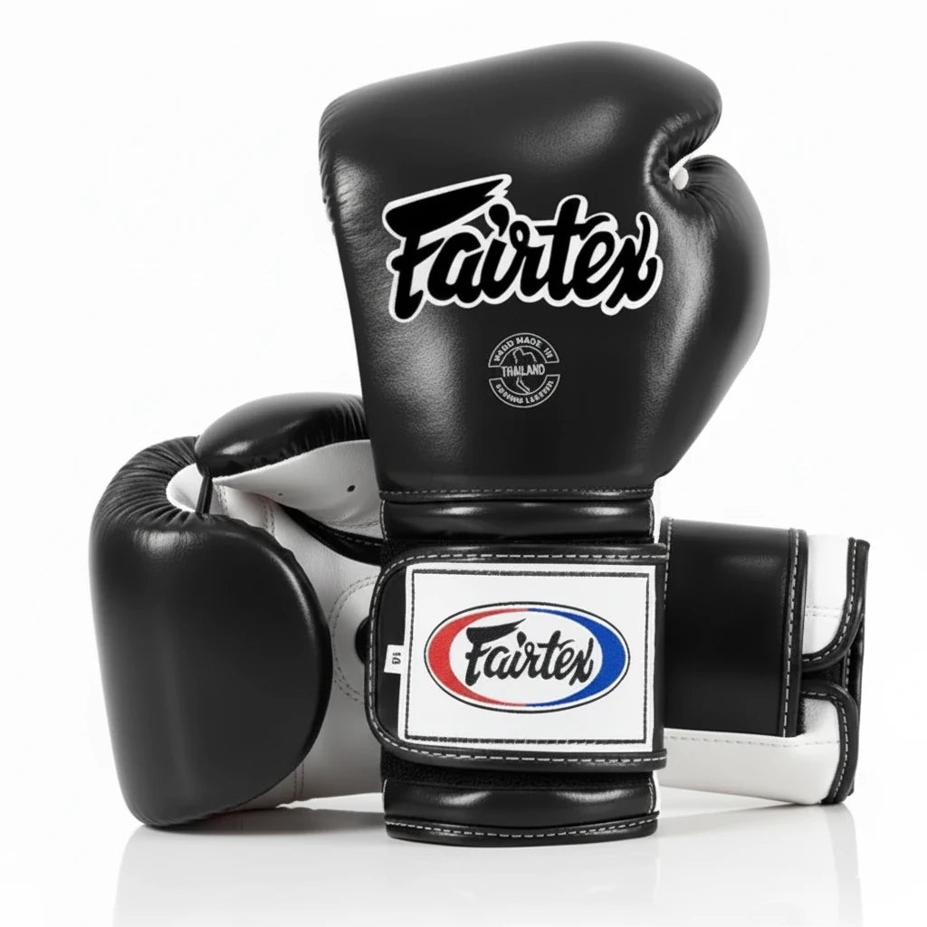 Black boxing glove with Fairtex logo on a white background