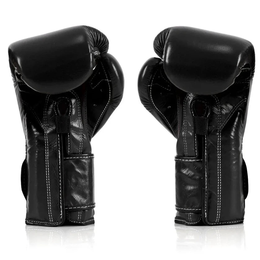 Pair of black boxing gloves on a white background