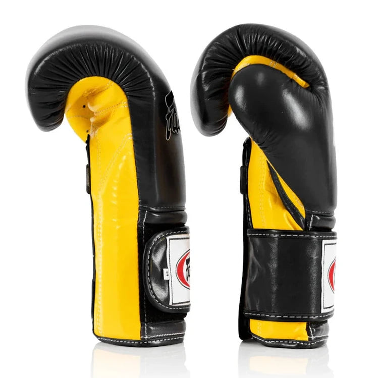 Black and yellow boxing gloves on a white background