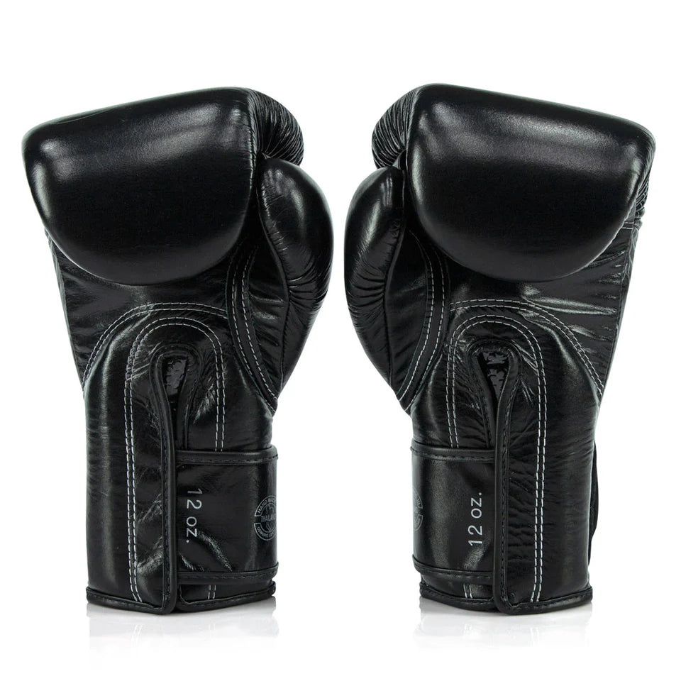 Pair of black boxing gloves on a white background