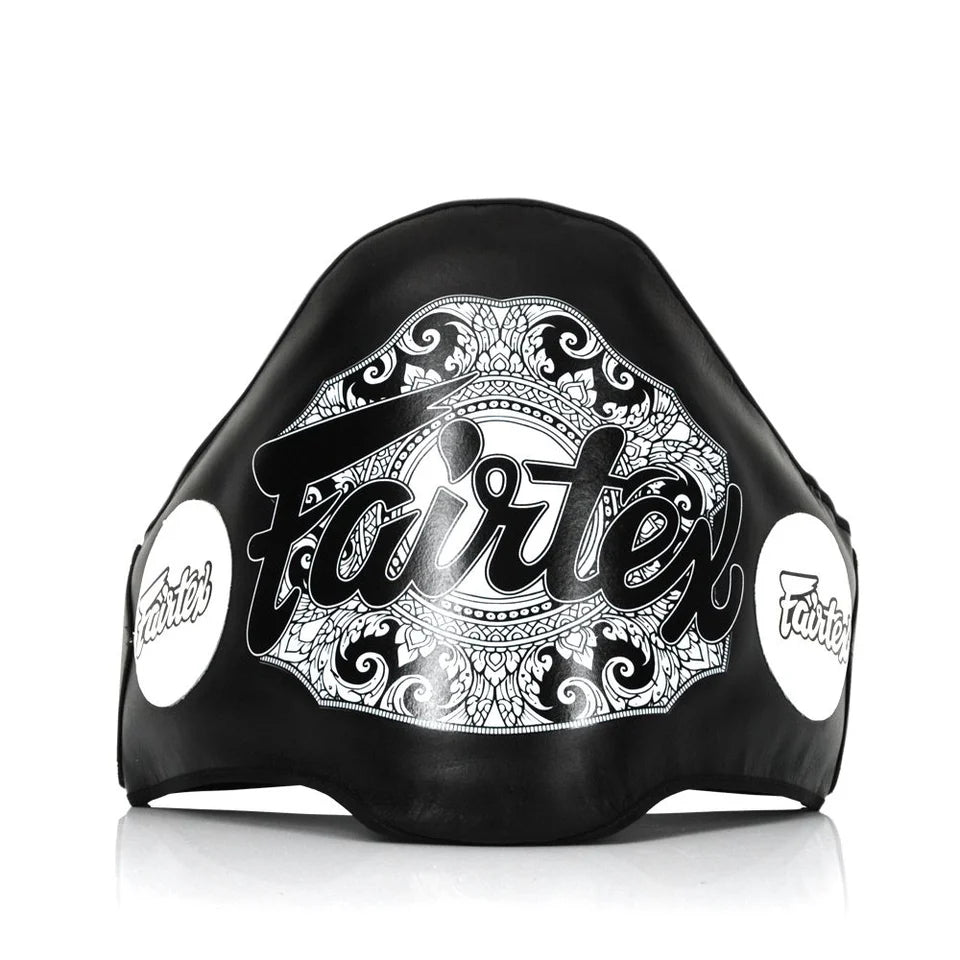 Black belly pad with white decorative patterns and 'Fairtex' branding on a white background