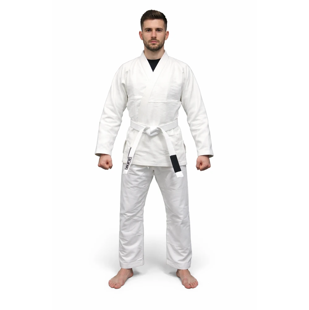 Man wearing a white martial arts gi on a white background