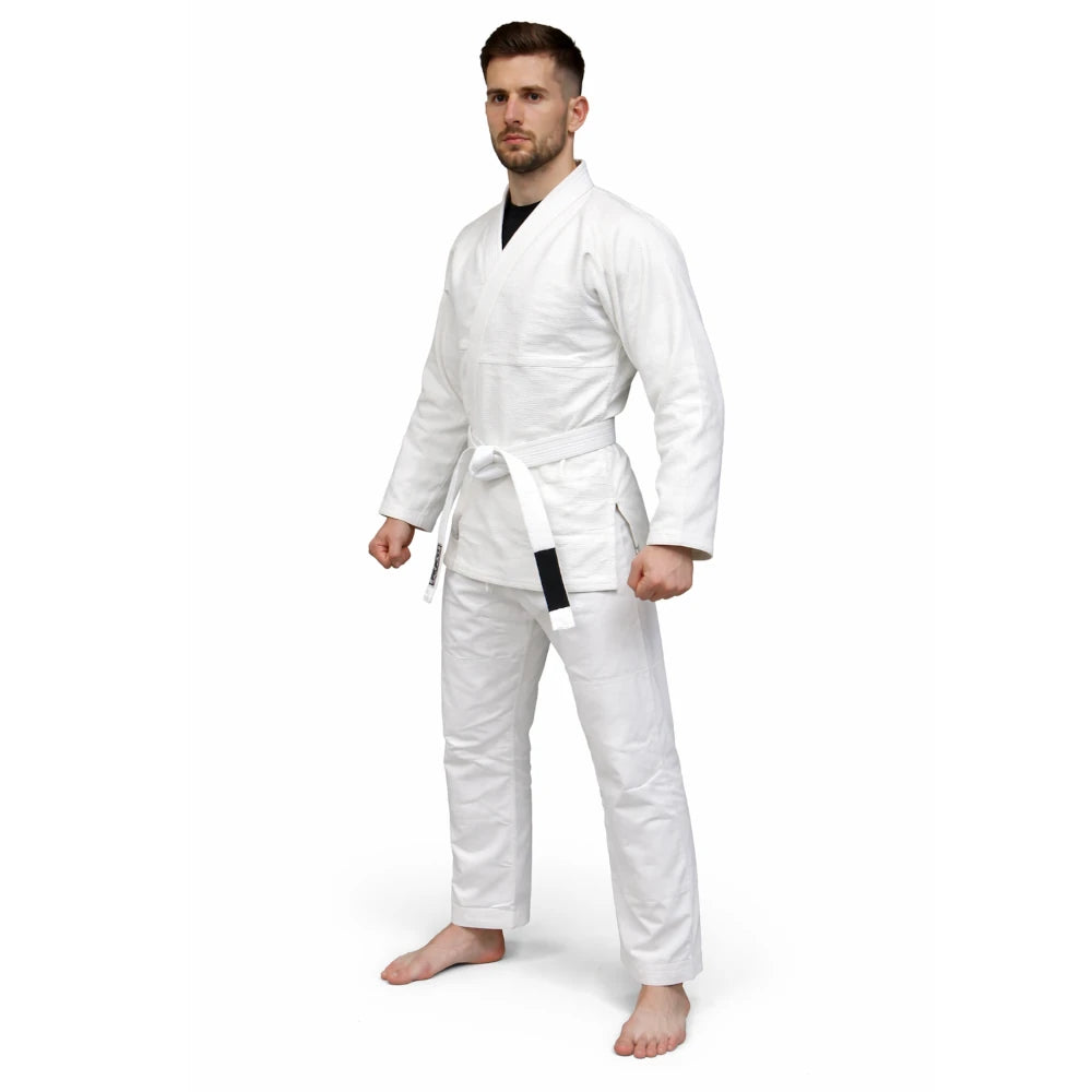 Man wearing a white martial arts gi on a white background