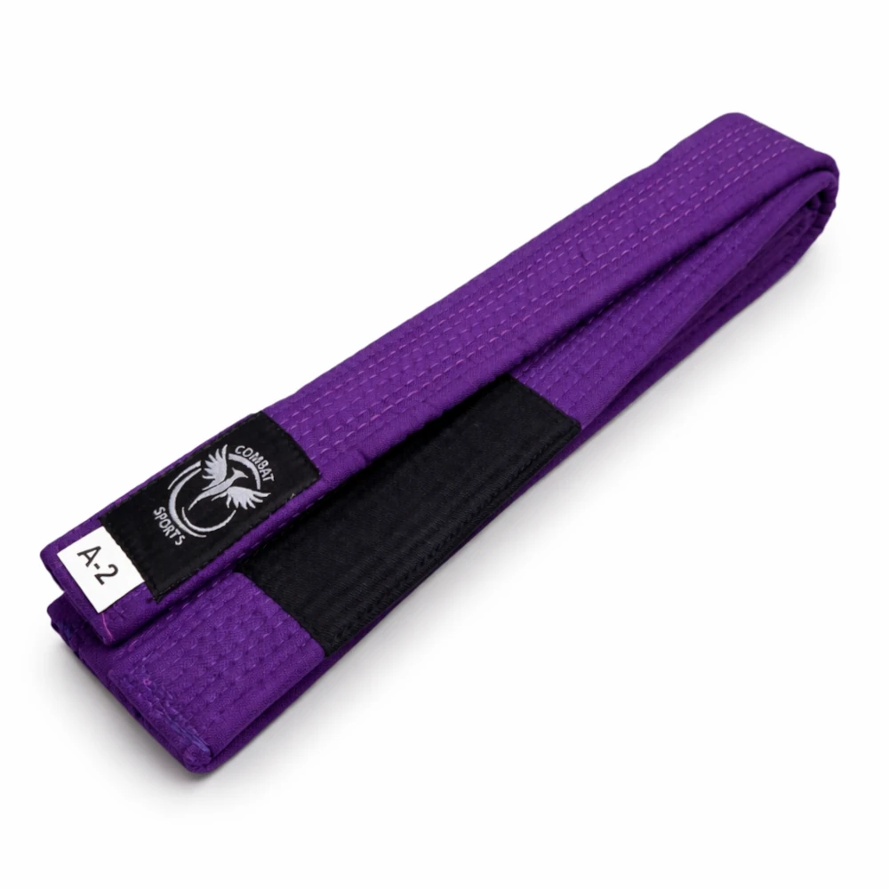 Purple martial arts belt with black patch on a white background
