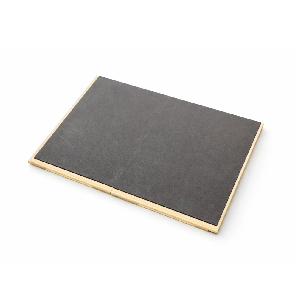 Black rectangular breakable board with a plastic border on a white background