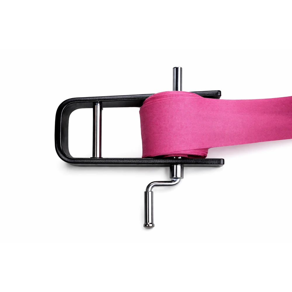 Black hand wrap roller with a pink wrap on a white background