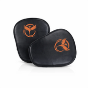 Two black boxing pads with orange logos on a white background