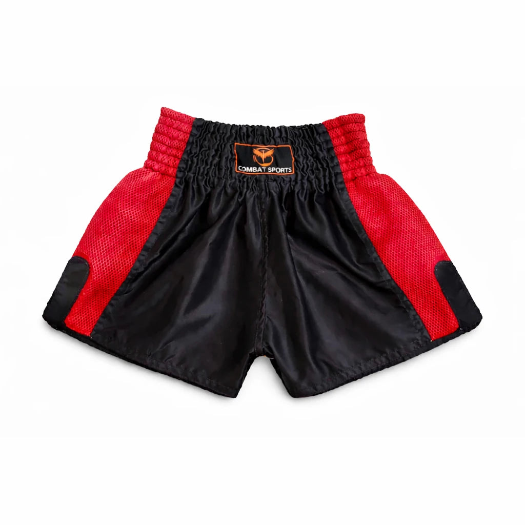 Black and red Thai boxing shorts with a brand logo on a white background