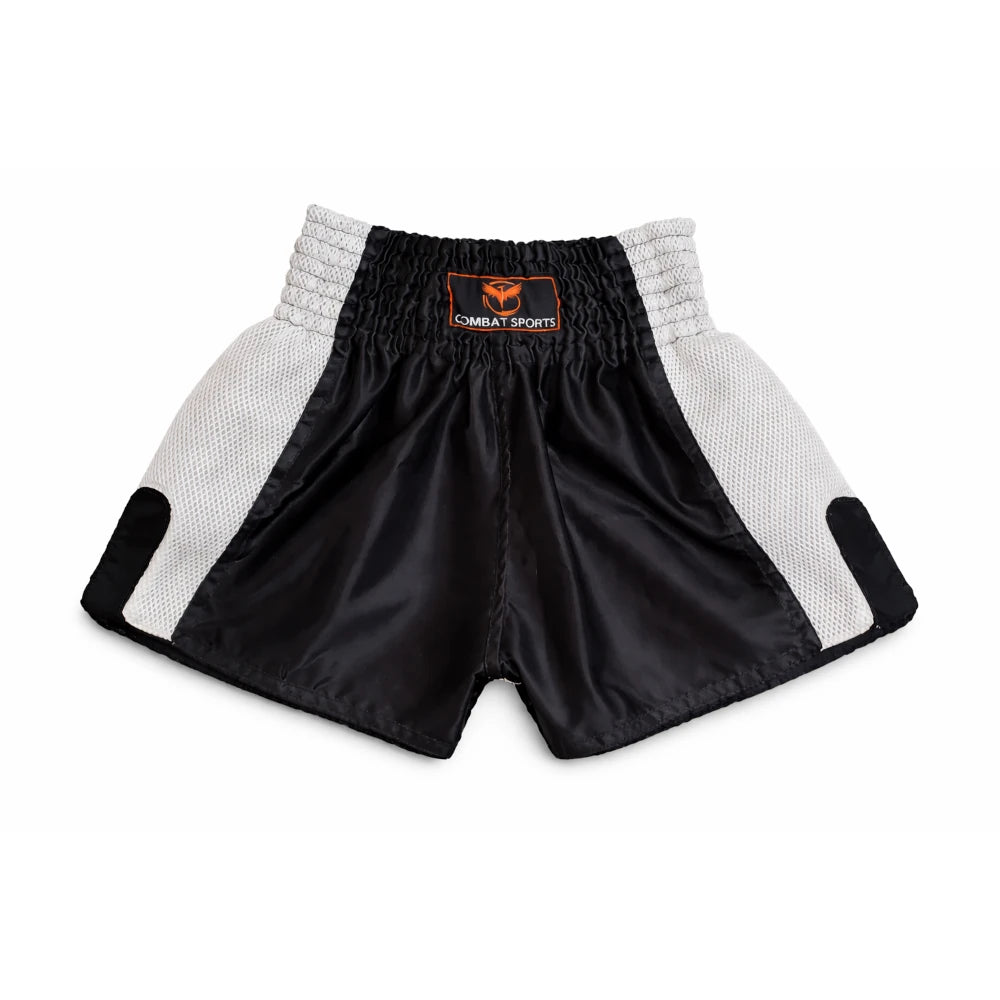 Black and white Thai boxing shorts with a visible brand logo on a white background