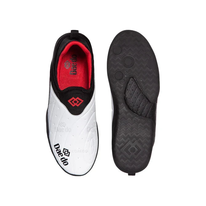 White martial arts shoes with black sole on a white background