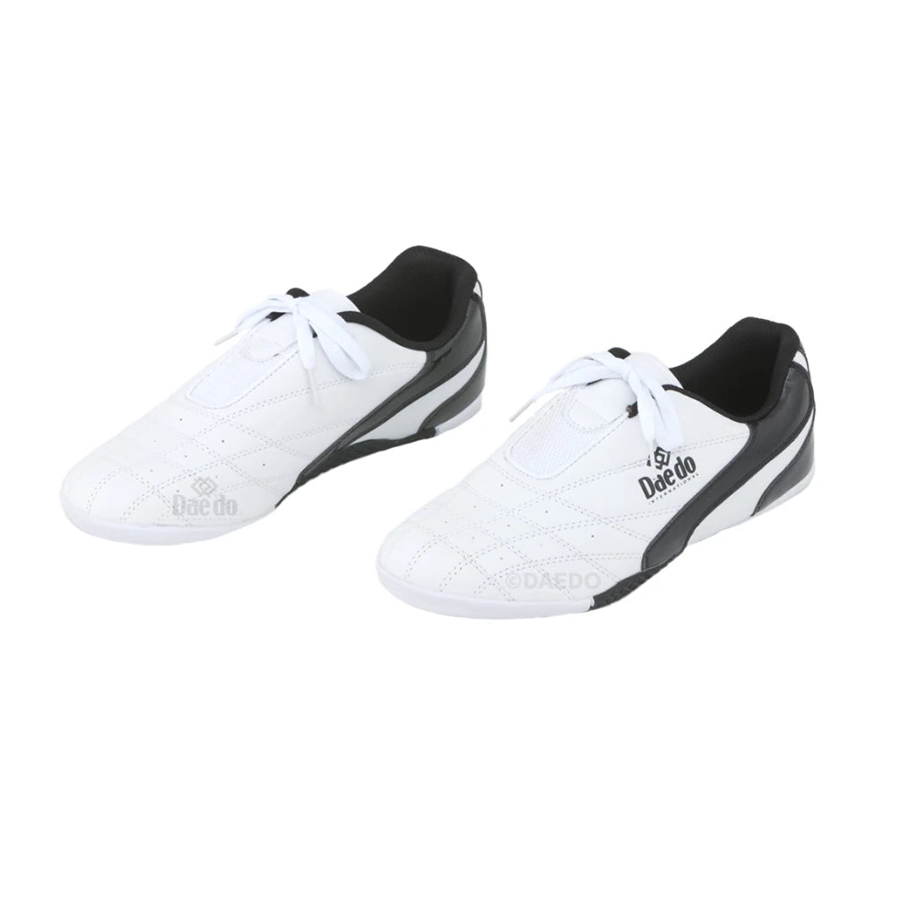 Pair of white and black Daedo shoes on a white background