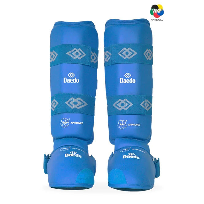 Pair of blue shin guards with 'Daedo' branding on a white background