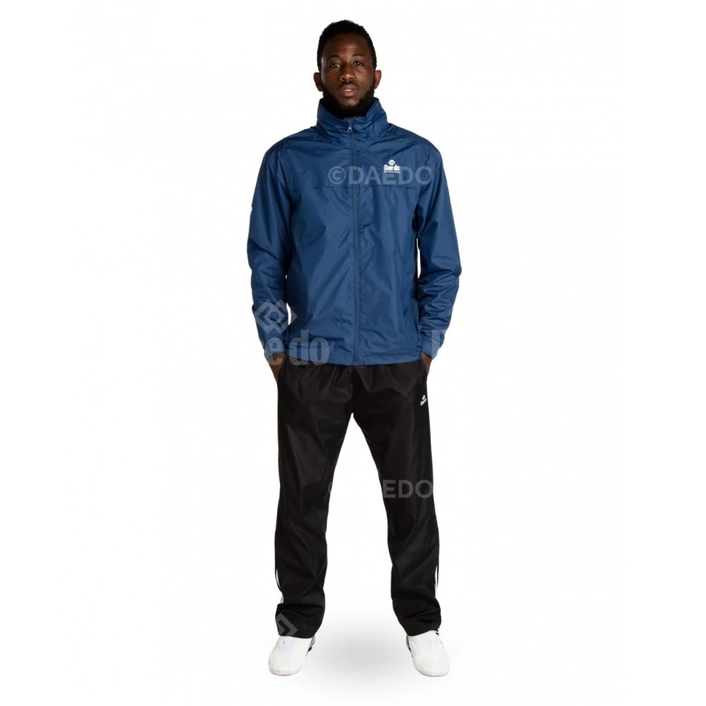 Person wearing a navy tracksuit with Daedo logo on a white background