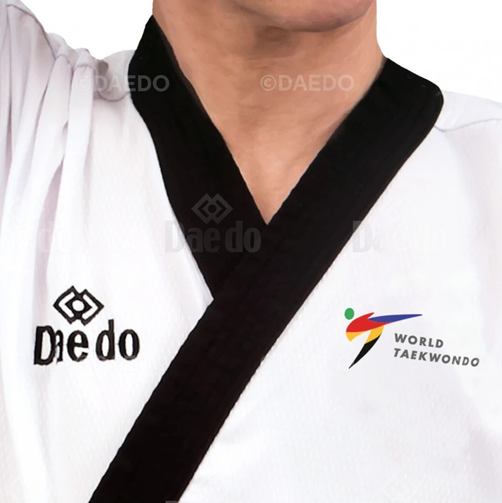 White martial arts uniform with black v-neck featuring 'Daedo' and 'World Taekwondo' logos.