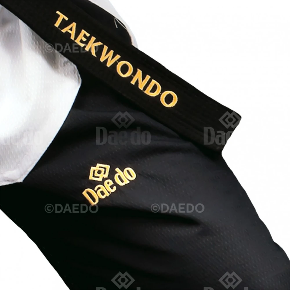 Black Taekwondo uniform with gold text and logos on a white background