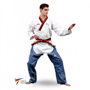 Male wearing a white martial arts uniform with blue pants on a white background