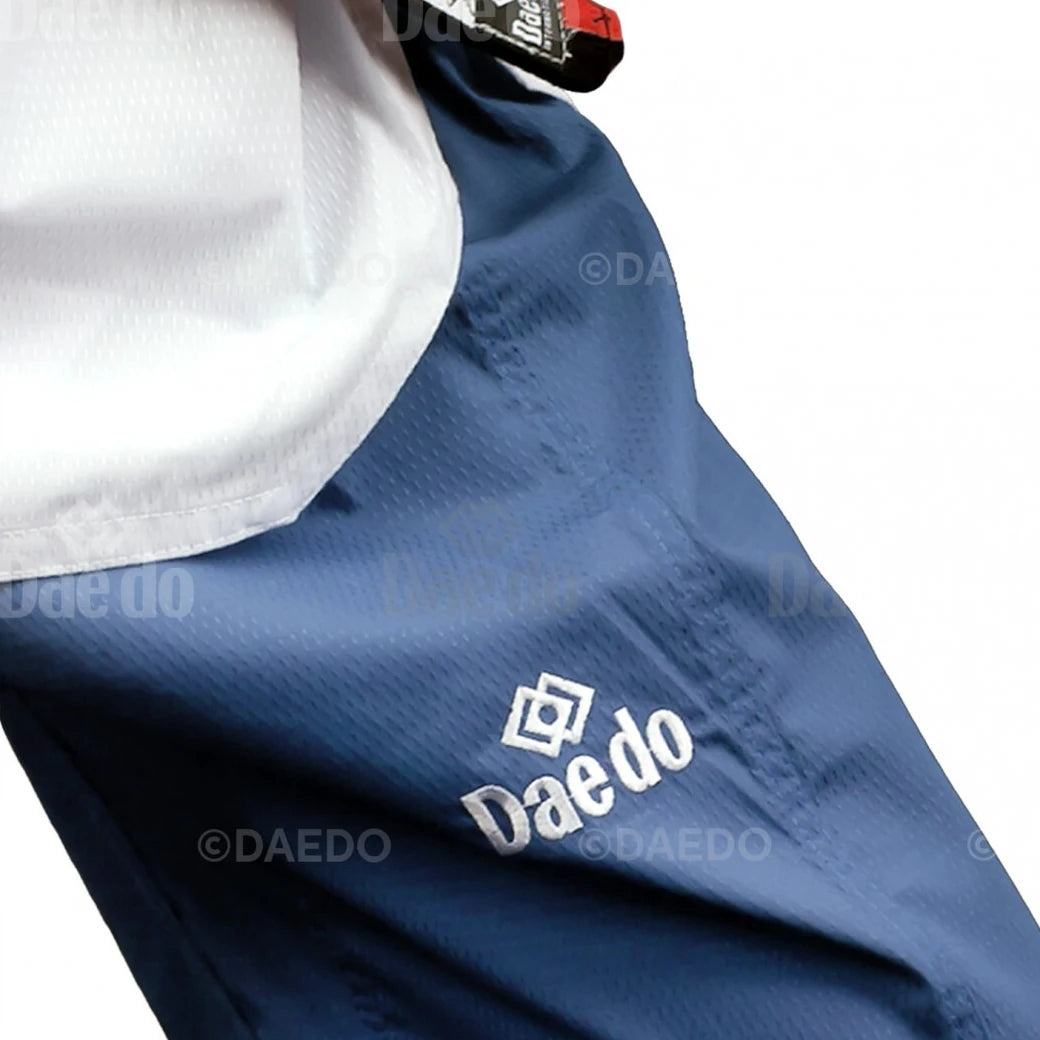Blue martial arts pants with 'Daedo' logo on a white background