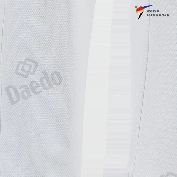 Close-up of a white martial arts uniform with 'Daedo' and 'World Taekwondo' logos.