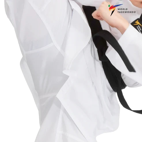 Person wearing a white martial arts uniform with a black belt, featuring the World Taekwondo logo.