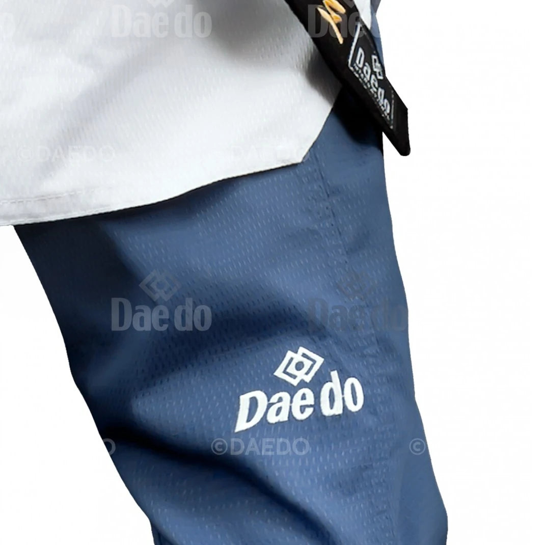Navy blue martial arts pants with 'Daedo' logo on a white background