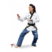 Woman in a white martial arts uniform with a black belt on a white background