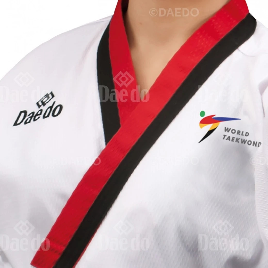White martial arts uniform with red and black trim featuring Daedo branding and World Taekwondo logo.