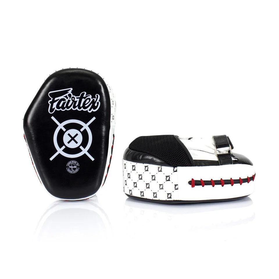 Black and white boxing mitts with Fairtex logo on a white background