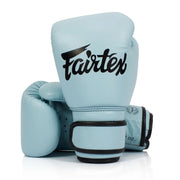 Light blue boxing gloves with black Fairtex logo on a white background