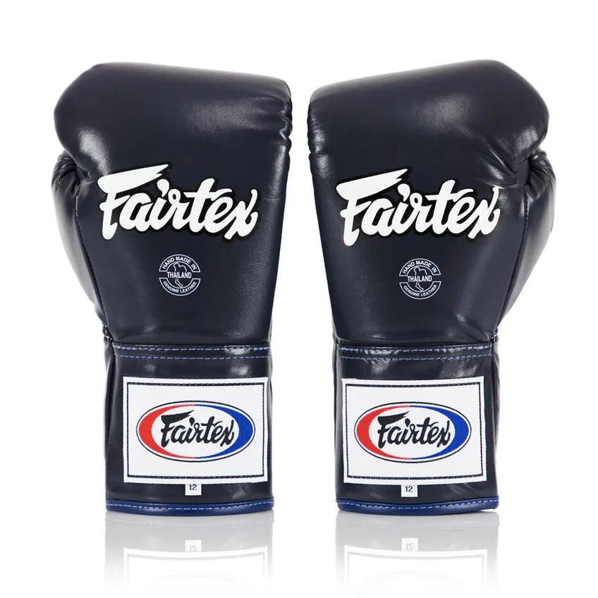 Pair of navy blue Fairtex boxing gloves on a white background