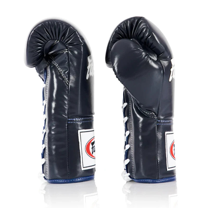 Pair of navy blue boxing gloves with white stitching on a white background