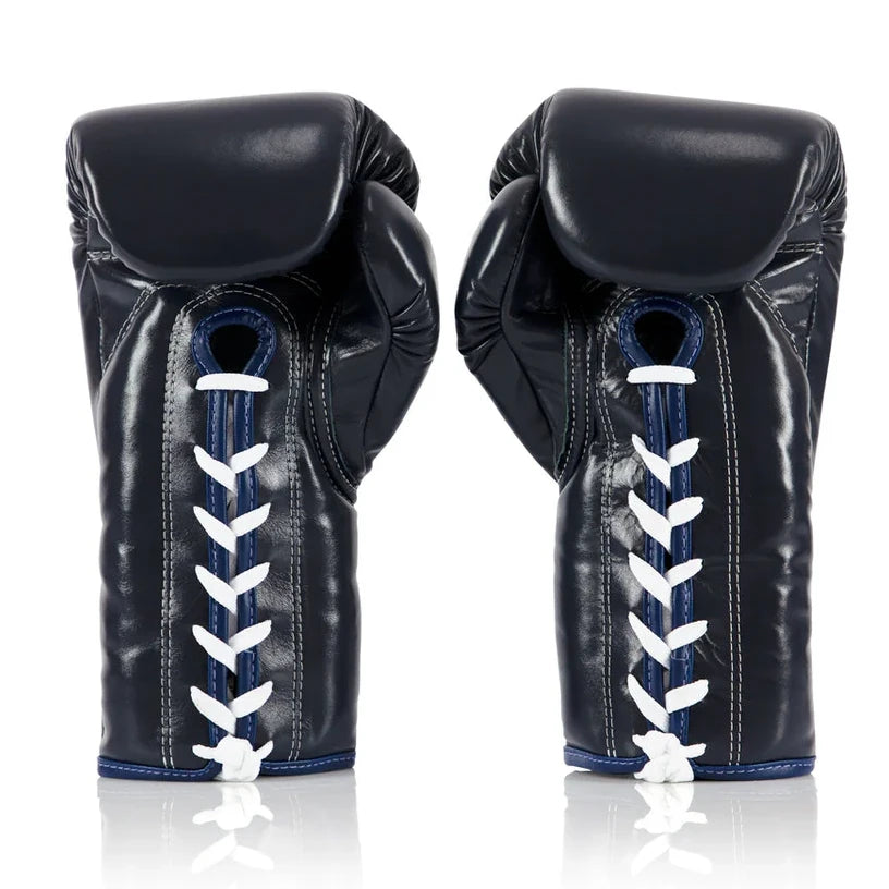 Pair of navy blue boxing gloves with white laces on a white background