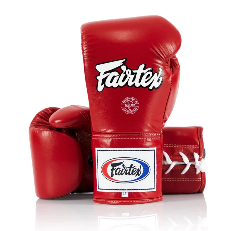 Red boxing gloves with Fairtex logo on a white background