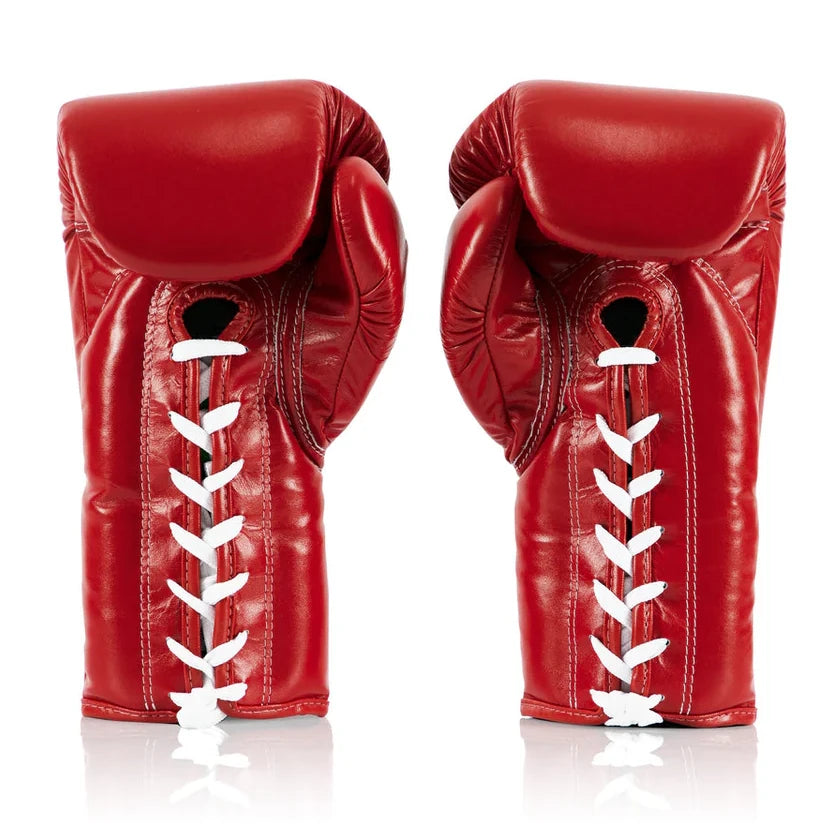 Pair of red boxing gloves with white laces on a white background