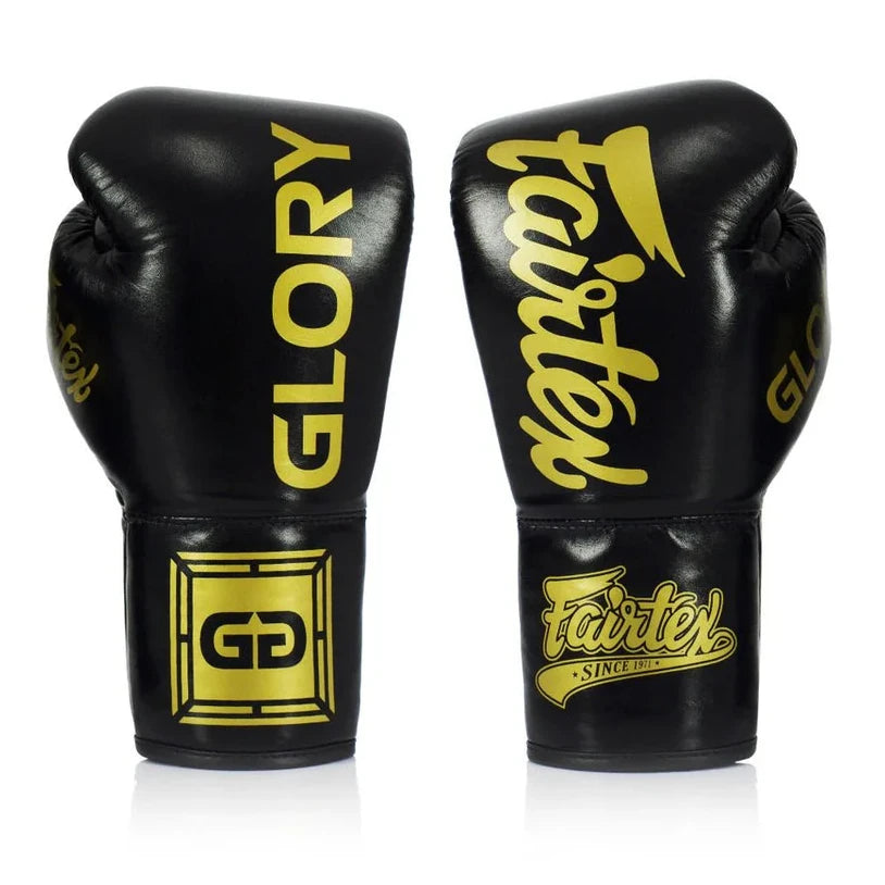 Black boxing gloves with yellow 'Fairtex' branding on a white background