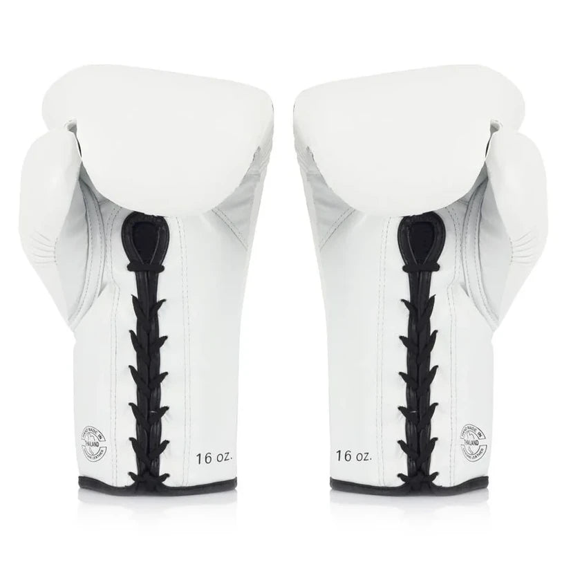 Pair of white boxing gloves with black laces on a white background