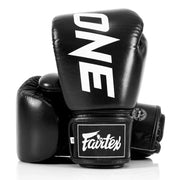 Black boxing gloves with 'ONE' and 'Fairtex' branding on a white background