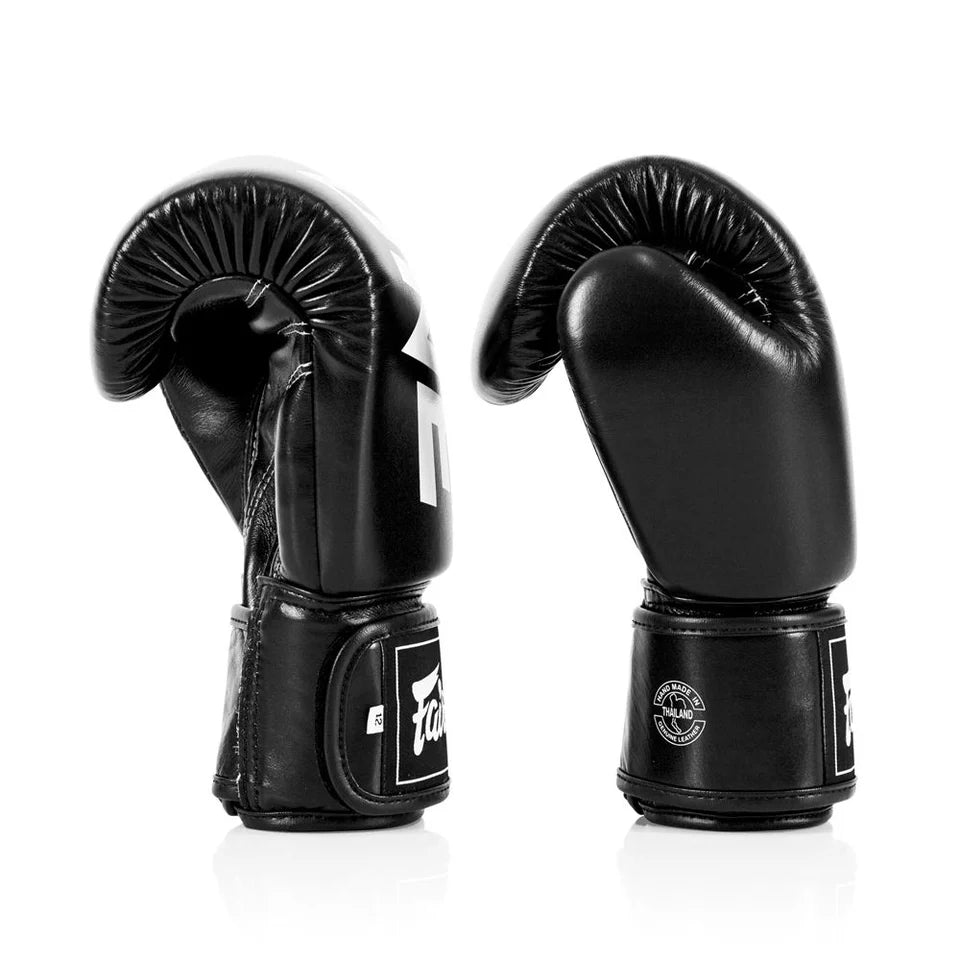 Pair of black boxing gloves on a white background