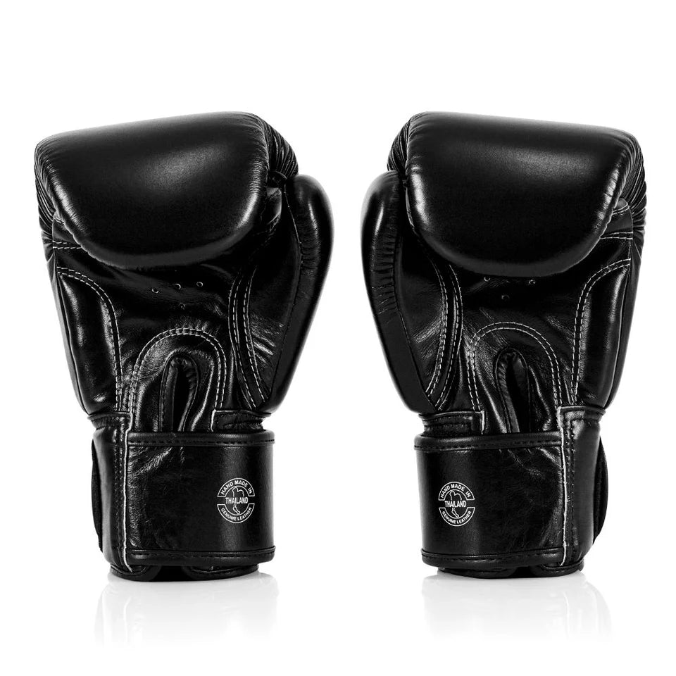 Pair of black boxing gloves on a white background