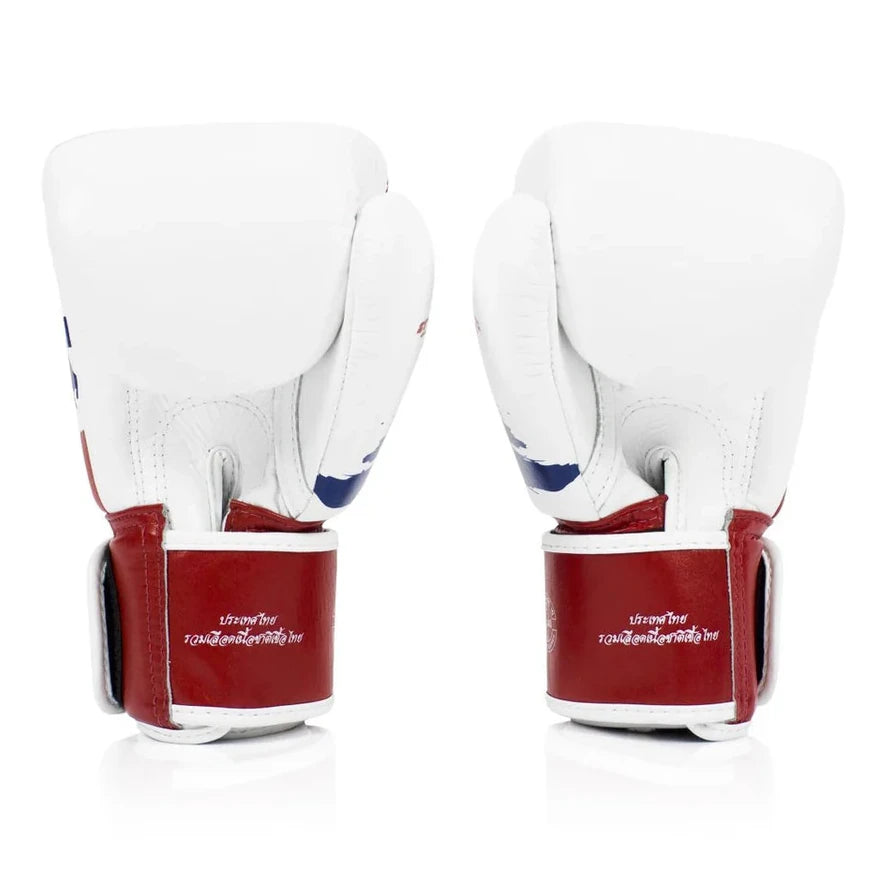 White boxing gloves with red accents on a white background