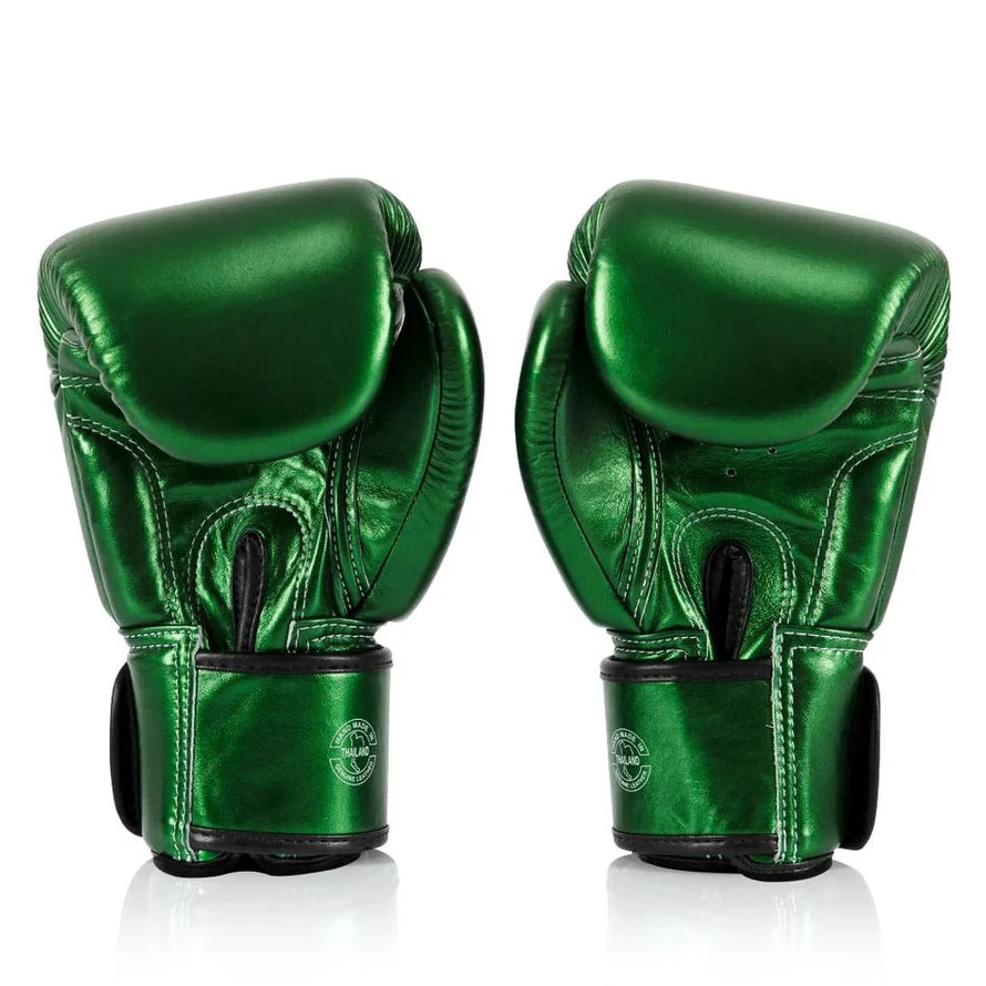 Pair of green boxing gloves on a white background