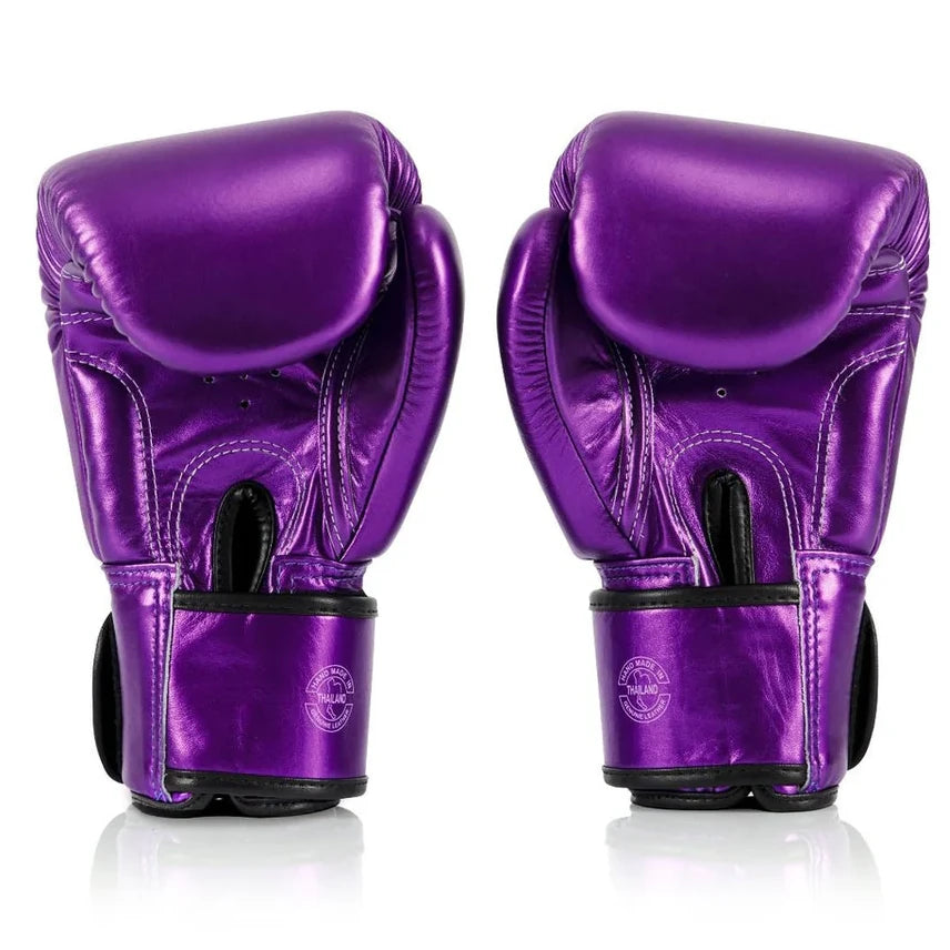 Pair of purple boxing gloves on a white background
