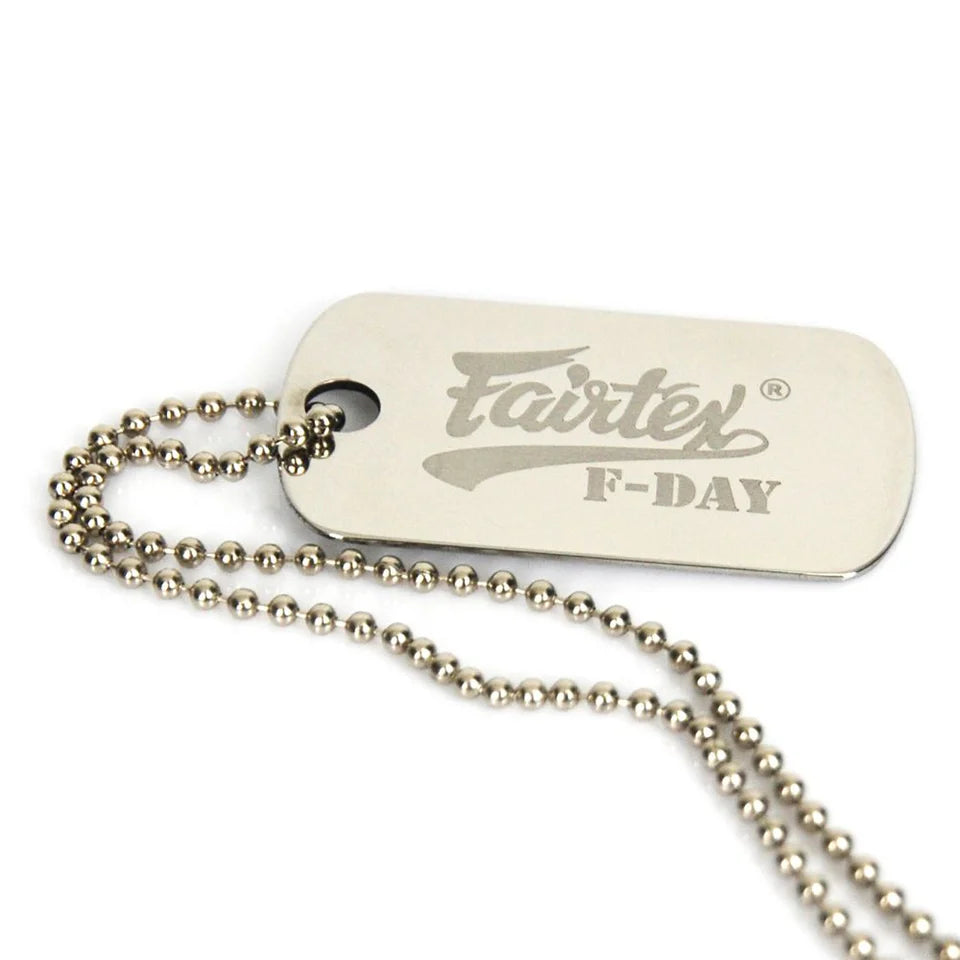 Dog tag with 'Fairtex' branding and 'F-Day' text on a white background