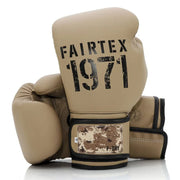 Pair of tan boxing gloves with 'Fairtex 1971' branding on a white background
