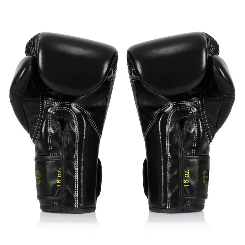 Pair of black boxing gloves with '16 oz' marking on a white background