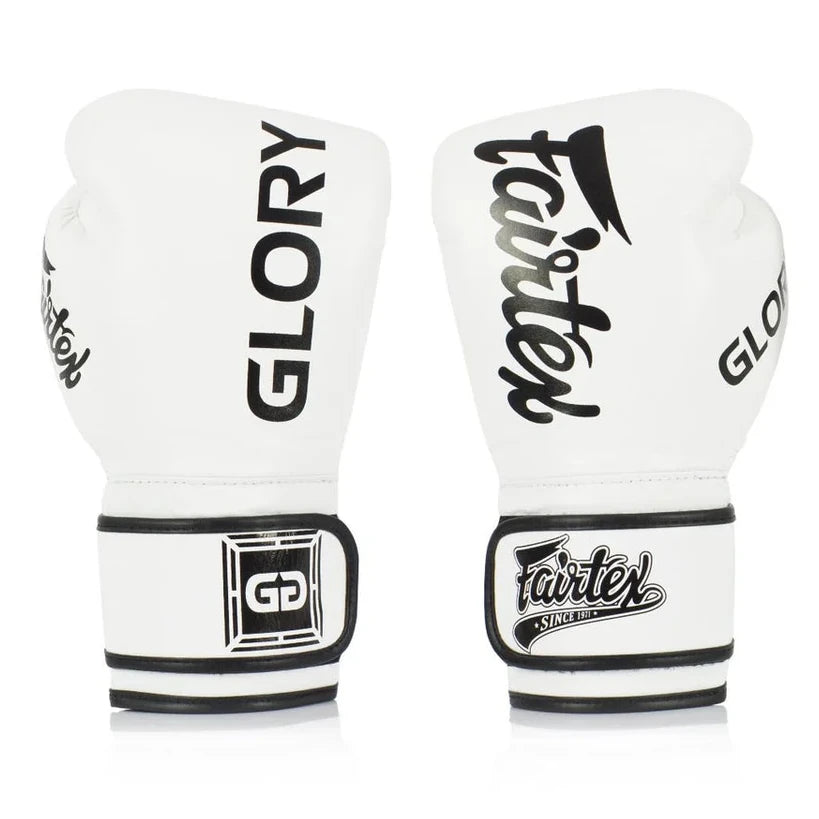 Pair of white boxing gloves with black branding on a white background