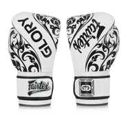 Pair of white boxing gloves with black patterns and Fairtex branding on a white background
