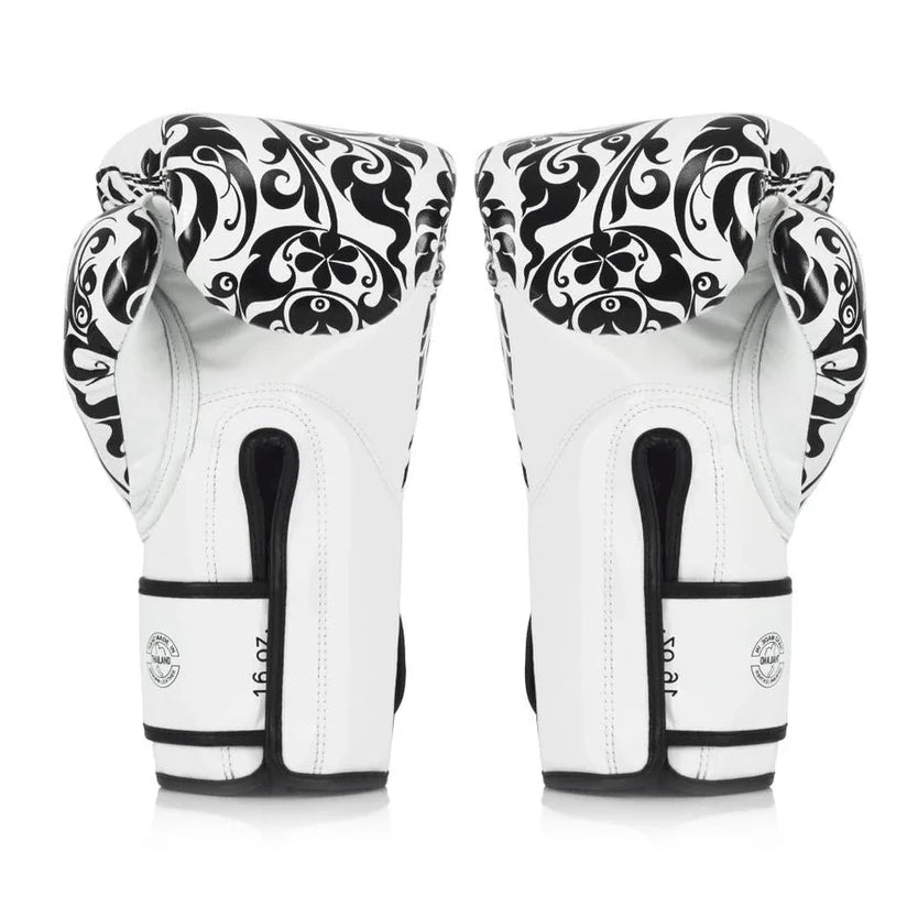 Pair of white boxing gloves with black patterns on a white background