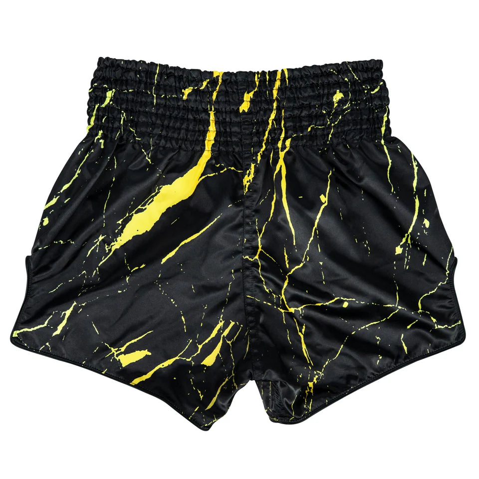 Muay Thai black shorts with yellow abstract pattern on a white background